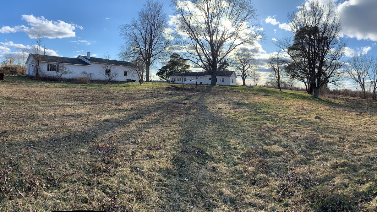 Panoramic view of property from farming field.