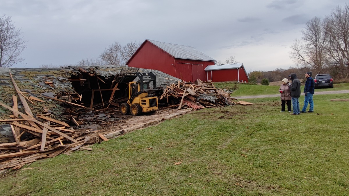 Helping the family remove an old barn from the property 