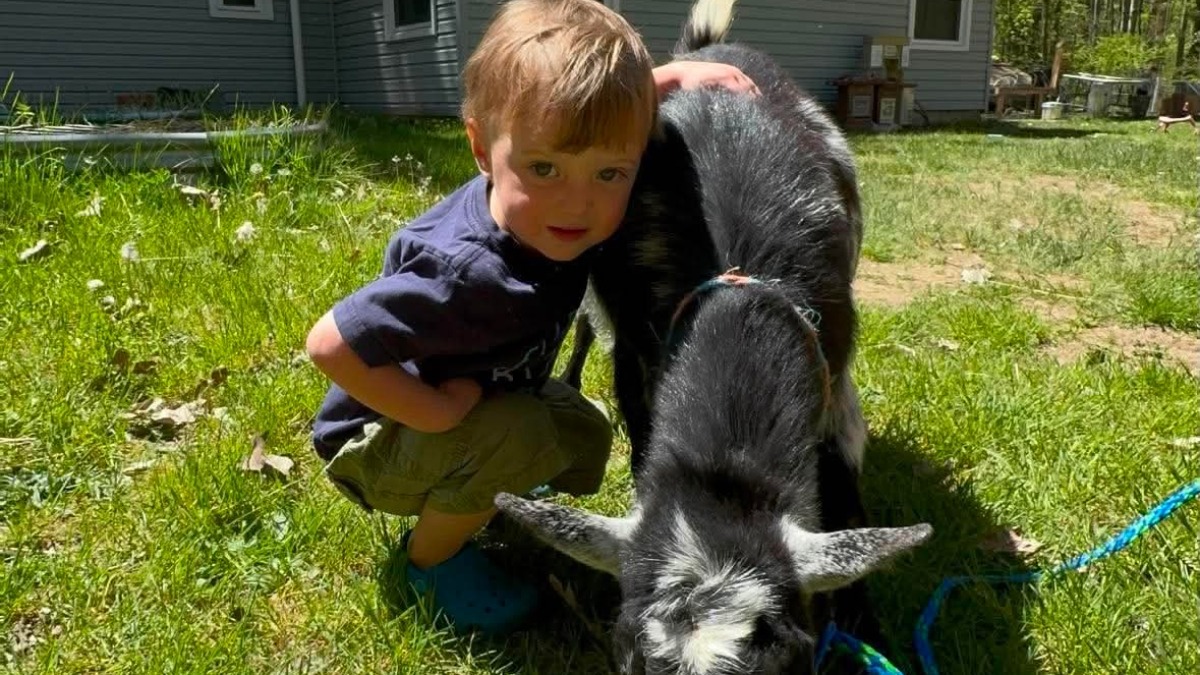 Our son and one of the milk goats