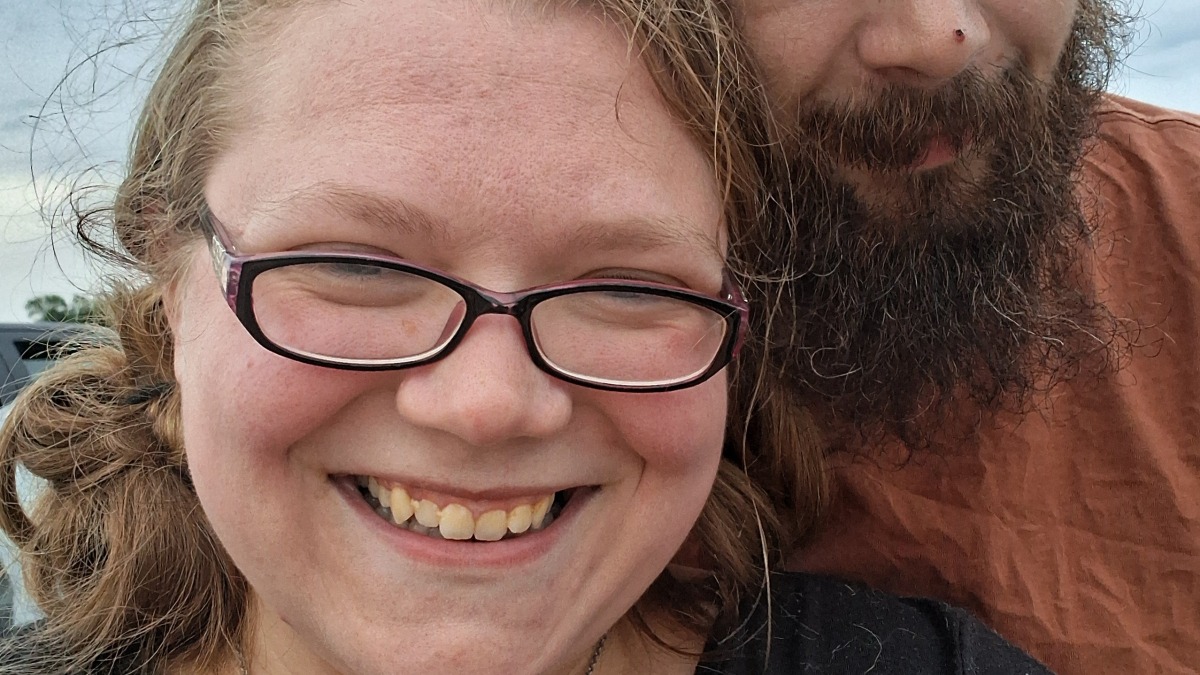 My husband and I at the drive in movie, we took a moment while my dad and daughter were watching band to have a moment for us