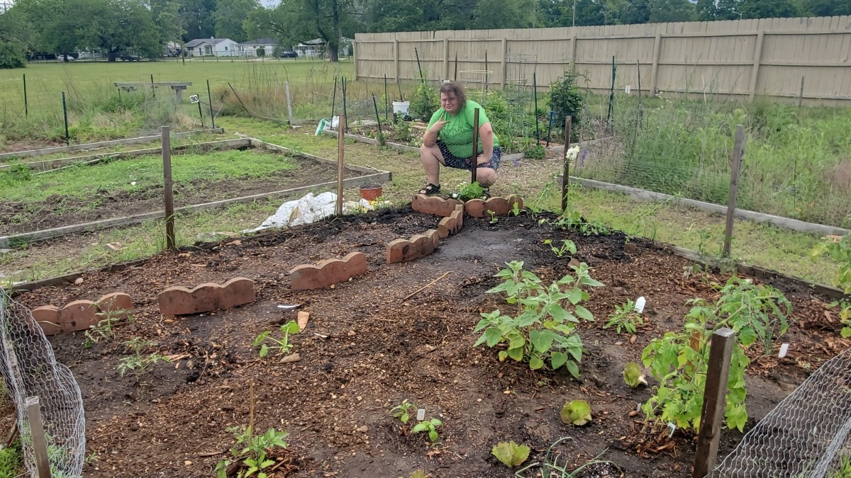 Myself after the initial planting of a small apartment garden