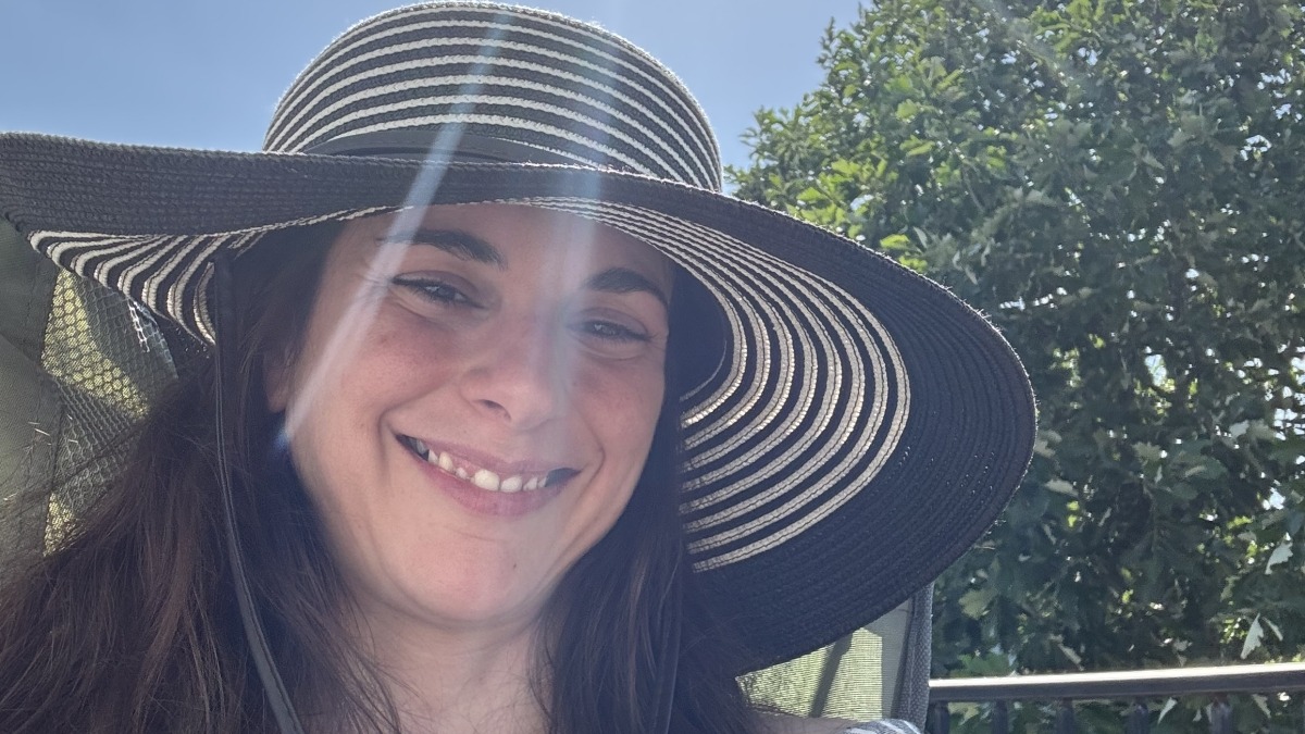 Girl wearing hat smiling 