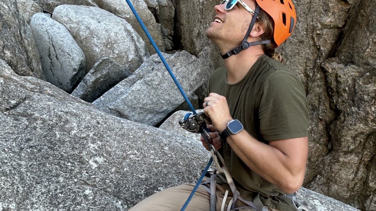 Chamus belaying his son climbing in Nova Scotia