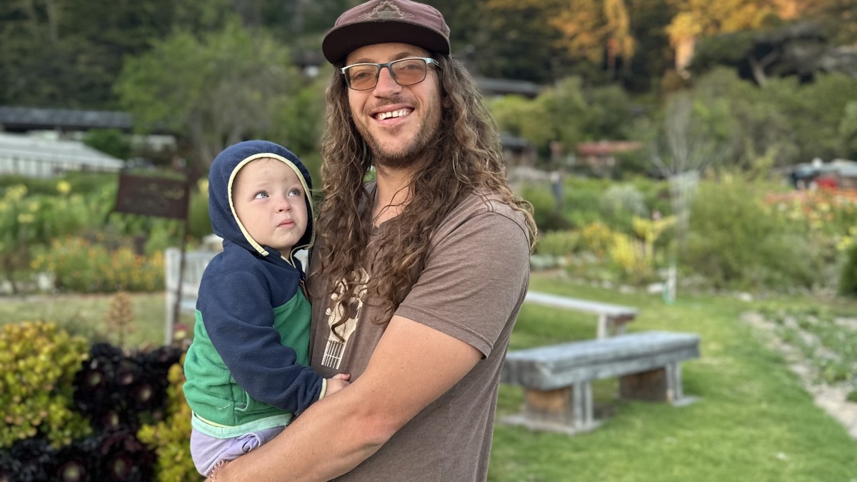 Anthony & our baby in the gardens.