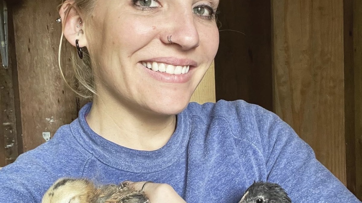 Holding 2 chicks
