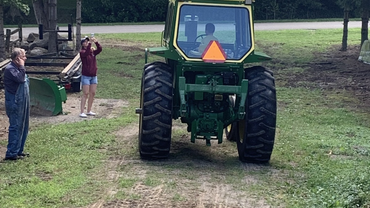 Our son driving Papa’s Tractor.