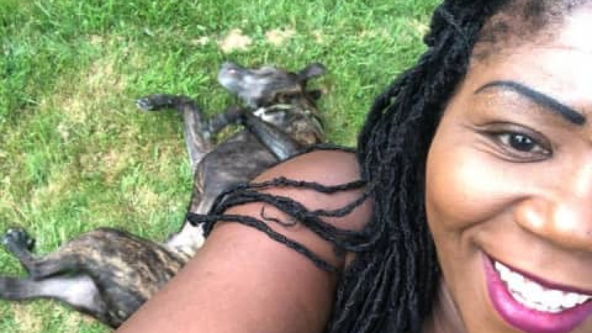 In my backyard with my Cane Corso. 