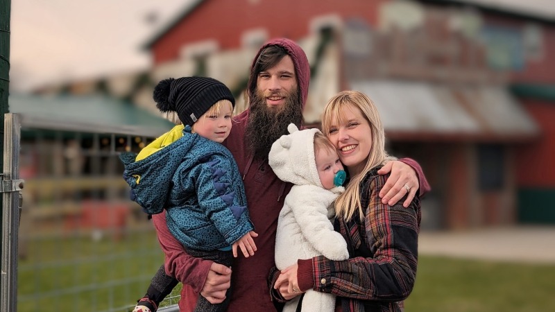 Dylan and his wife shortly before their thirdborn.