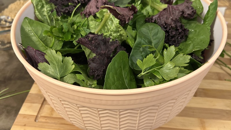 A bowl of assorted greens for salad 