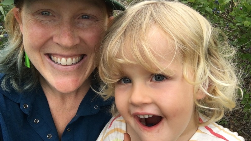 Picking blueberries with a helper