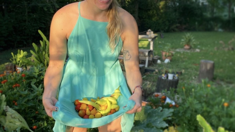 Carry vegetables from the garden in dress