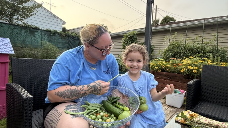 Mom and our oldest in the garden 