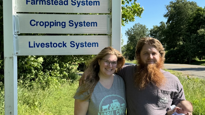 Pictures  of our family by our sign 