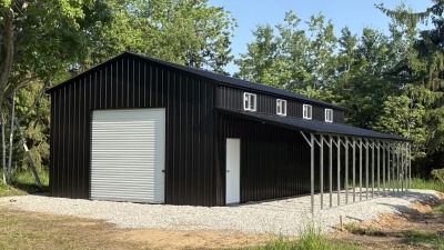 Newly constructed steel building for equipment storage.
