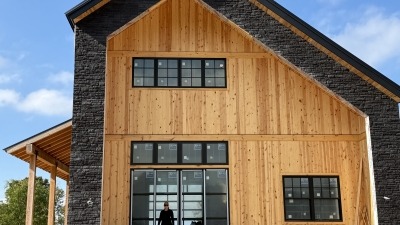 The newly constructed farm house featuring post and beam construction with an open floor plan and loft.