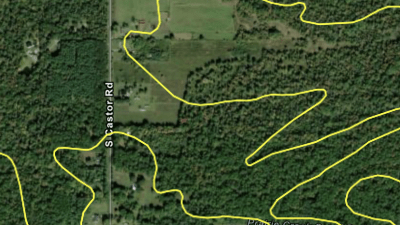 Aerial view of farmland and woods